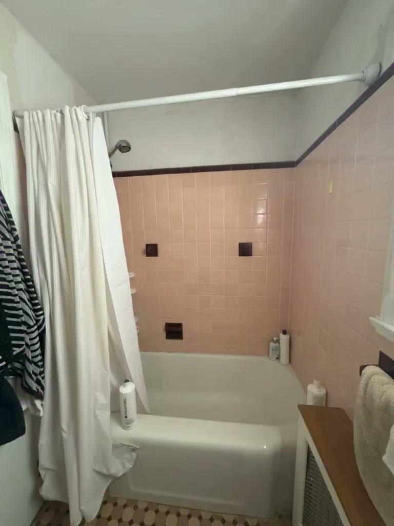 Video walkthrough of a pink bathroom remodeled into a modern white and gray bathroom in Connecticut