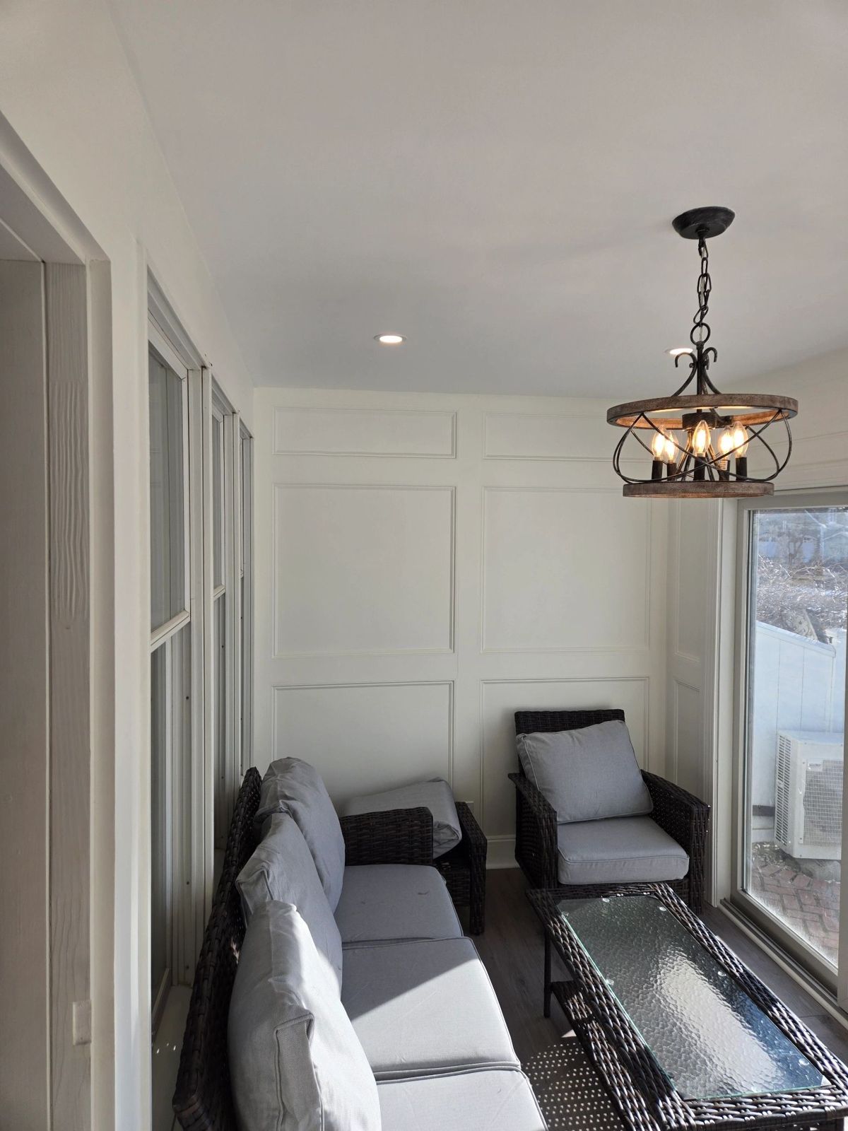 Finished sunroom interior with paneled walls in southeastern CT